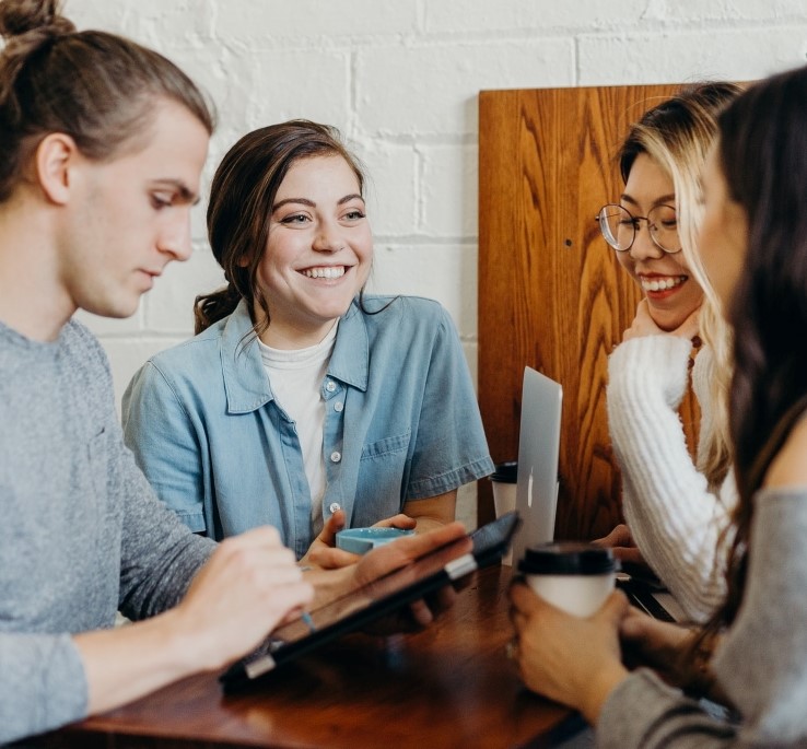 a photo of a group of college students studying together