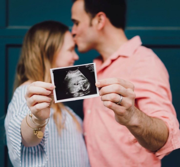 a photo of a pregnant couple